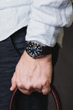 Aquacy Automatic Vintage Black and Blue Dial Watch On Wrist Standing