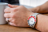 Aquacy Seiko Movement Watch Red And Black On Wrist Holding Cup