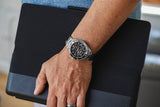 Aquacy Automatic Skeleton Watch Silver And Black On Wrist Standing