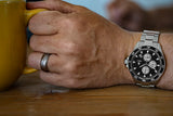Aquacy Automatic Chronograph Watch Black Panda On Wrist Holding Cup