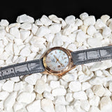 Mother Of Pearl Watch Laying on stones Picture