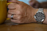 Aquacy Automatic Chronograph Watch Gun Metal Gray On Wrist Holding Cup